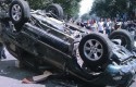 Over-turned Japanese-branded car / AP