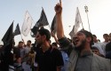 Libyan followers of the Ansar al-Shariah Brigades chant anti-U.S. slogans during a protest / AP