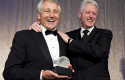 Hagel giving Clinton an Atlantic Council award (2010) / AP