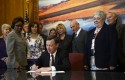 Colorado Gov. John Hickenlooper signing gun control legislation (AP)