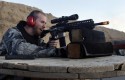 A man shoots an AR-15 rifle, at Dragonman's firing range and gun dealer, outside Colorado Springs, Colo. / AP