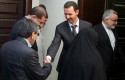 Syrian President Bahsar Assad shakes hands with one of the Iran's parliamentary committee on national interest and foreign policy / AP