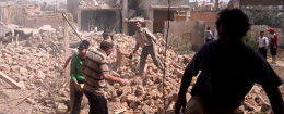 Syrians inspect rubble of damaged buildings due to government airstrikes, in Qusair, Syria. The town has been besieged by regime troops and pro-government gunmen backed by Hezbollah. (AP)