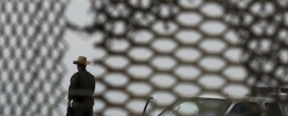 A U.S. Border Patrol agent is seen from Mexico through the fence along the US-Mexico border / AP