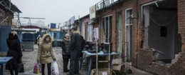 A woman visits a market in the Mariupol, which was recently attacked by Russia-backed separatists. / AP