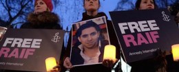 Raif Badawi protest. Protesters during an Amnesty International candle-lit protest vigil for blogger and free speech activist Raif Badawi outside the Saudi Arabia Embassy. In Mayfair, London