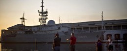Men fish near the Russian warship Viktor Leonov CCB-175, docked in Havana's harbor, Cuba, Wednesday, Jan. 21, 2015