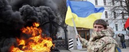 A serviceman from the battalion "Aydar" waves a Ukrainian flag during a protest against the disbanding of the battalion, in front of Ukraine's Defence Ministry in Kiev February 2 / Reuters