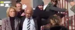 Sec. of Education Betsy DeVos, left, escorted away from protesters / Twitter video screenshot