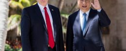 Chinese President Xi Jinping waves to the press as he walks with US President Donald Trump at the Mar-a-Lago estate in West Palm Beach, Florida