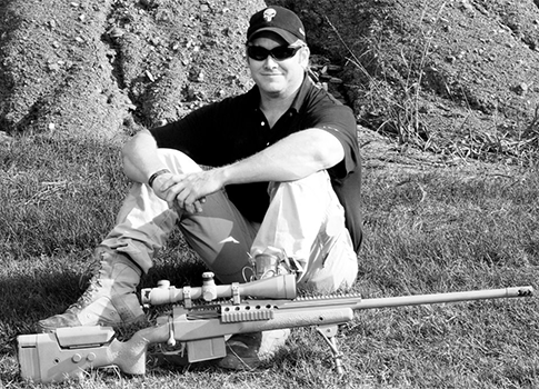 Kyle with his Lapua .338, the gun used to make his longest kill / Facebook 