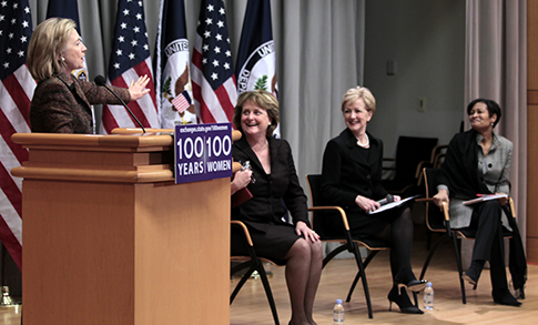 Secretary of State Hillary Clinton gestures as a panel at the 100 Women Initiative looks on at the State Department in 2011. (AP)