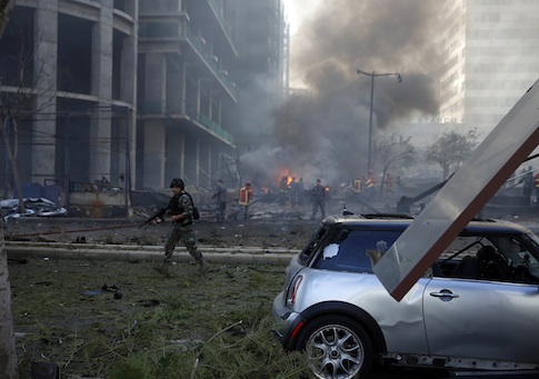 Fires burn and smoke rises from the site of explosion in Beirut downtown area