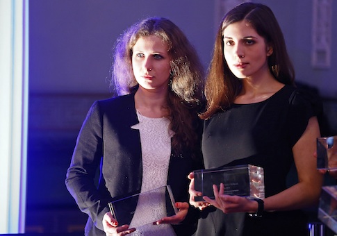 Russian punk band Pussy Riot members Alyokhina and Tolokonnikova pose after winning a trophy in the category "Most Valuable Documentary of the Year" at the "Cinema for Peace" charity gala in Berlin