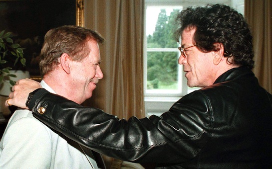 Czech President Vaclav Havel,left, gets a friendly pat on his shoulder from American rock star Lou Reed