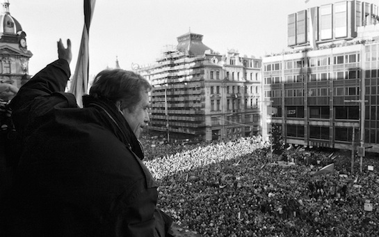 Havel waves to people crowding Wenceslas Square in Prague on Human Rights Day