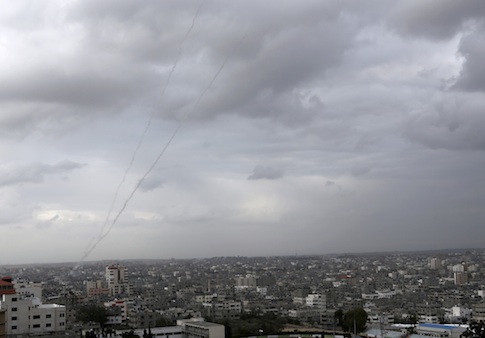 A trail of smoke from rockets fired by Palestinian militants from Gaza toward Israel is seen above Gaza City on Wednesday