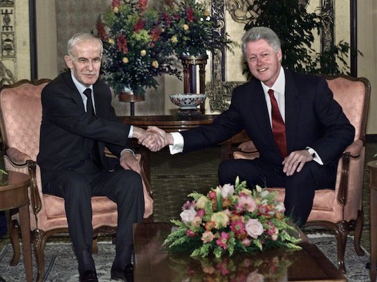 Former President Bill Clinton greets the late Syrian leader Hafez Assad. (AP)