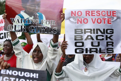 Women attend a demonstration calling on government to rescue kidnapped school girls