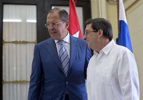 Cuba's Foreign Minister Bruno Rodriguez, right, walks with Russian's Foreign Minister Sergey Lavrov at the Foreign Ministry in Havana, Cuba