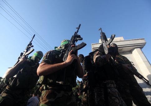 Palestinian militants from various armed factions, including Hamas, attend a news conference in Gaza City