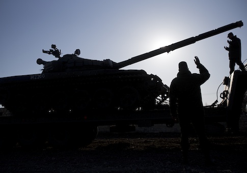 Russian officers gesticulate to the driver of Russian tank T-72B at the Ostryakovo railway station not far from Simferopol, Crimea