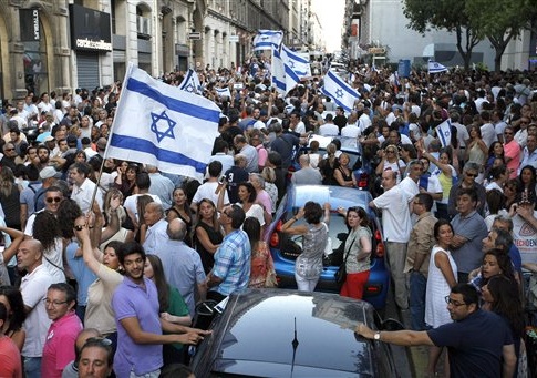 Supporters of Israel wave flags and shout slogans during a demonstration in Marseille