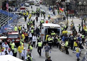 medical workers aid injured people near the finish line of the 2013 Boston Marathon following two bomb explosions