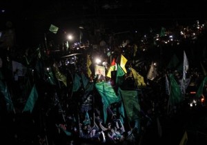 Palestinians take the streets in Gaza on August 26, 2014 to celebrate a long-term cease-fire with Israel