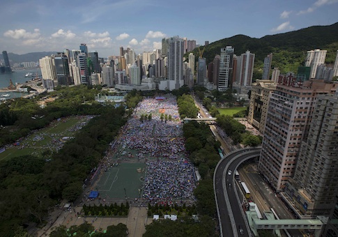 Thousands of pro-Beijing protesters gather to march in the streets to demonstrate against a pro-democracy Occupy Central campaign in Hong Kong