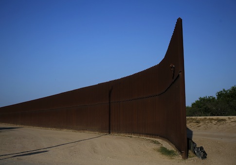 A break in the border fence at the United States-Mexico border is seen outside of Brownsville, Texas