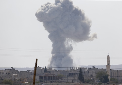 Smoke rises after an U.S.-led air strike in the Syrian town of Kobani Ocotber 9