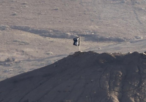 Black flag belonging to the Islamic State is seen near the Syrian town of Kobani, as pictured from the Turkish-Syrian border near the southeastern town of Suruc in Sanliurfa province