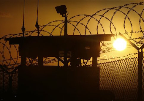 In this photo reviewed by the U.S. military, the sun rises above Camp Delta at Guantanamo Bay Naval Base, Cuba, Wednesday, Nov. 20, 2013