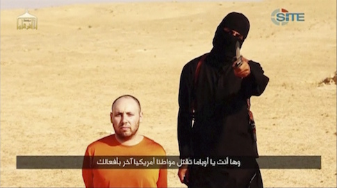 A masked, black-clad militant, who has been identified by the Washington Post newspaper as a Briton named Mohammed Emwazi, stands next to a man purported to be Steven Sotloff in this still image from a video obtained from SITE Intel Group website