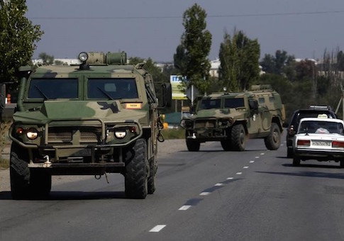 Russian army's armoured vehicles are seen on a road in Kamensk-Shakhtinsky, Rostov region, near the border with Ukraine, August 23, 2014