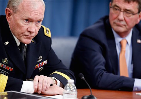 Joint Chiefs of Staff Gen. Martin Dempsey, left, accompanied by Secretary of Defense Ash Carter, right, speaks during a news conference at the Pentagon, Thursday, April 16
