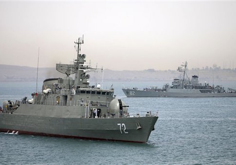 In this picture taken on Tuesday, April 7, 2015, and released by the semi-official Fars News Agency, Iranian warship Alborz, foreground, prepares before leaving Iran's waters