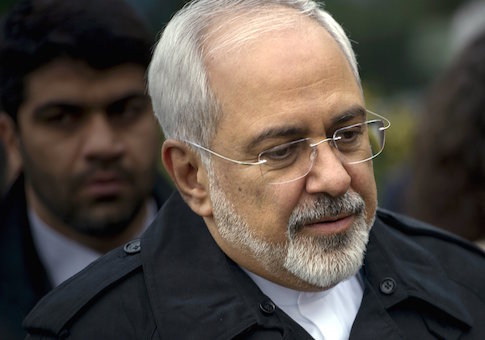 Iranian Foreign Minister Javad Zarif is seen as he walks through a courtyard at the Beau Rivage Palace Hotel during an extended round of talks in Lausanne