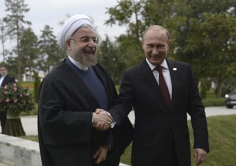 Russia's President Putin shakes hands with his Iranian counterpart Rouhani at the welcoming ceremony during a summit of Caspian Sea regional leaders in the southern city of Astrakhan