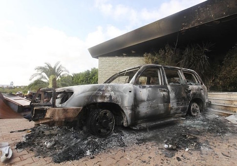 A burnt car is parked at the U.S. consulate, which was attacked and set on fire by gunmen yesterday, in Benghazi