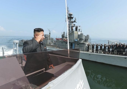 North Korean leader Kim salutes during a landing drill of the Army Ground, Naval, Air and Anti-Air forces of the KPA