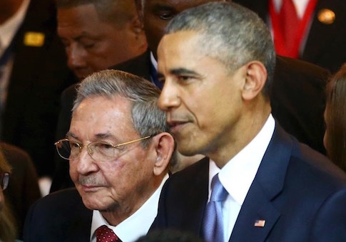 Cuba's President Raul Castro stands with his U.S. counterpart Barack Obama before the inauguration of the VII Summit of the Americas in Panama City