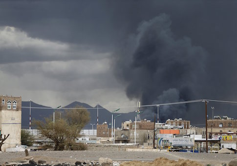 Smoke billows after an air strike hit the international airport of Yemen's capital Sanaa