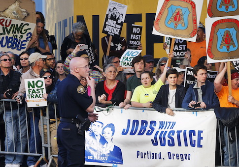 Protesters rally outside the hotel where Obama is participating in a Democratic National Committee (DNC) event in Portland, Oregon