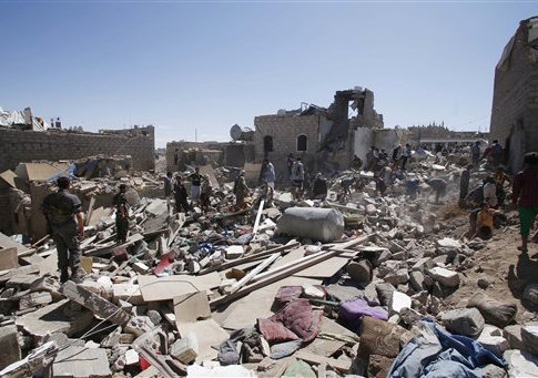 People search for survivors under the rubble of houses destroyed by Saudi-led airstrikes in Sanaa, Yemen