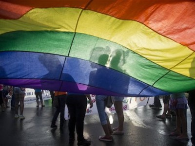 Members of the LGBT movement hold a gay pride flag as they attend a march to mark the International Day Against Homophobia in Managua, Nicaragua