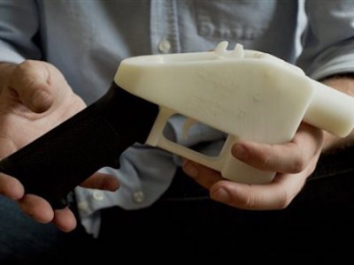 This photo taken May 10, 2013 shows Cody Wilson holding what he calls a Liberator pistol