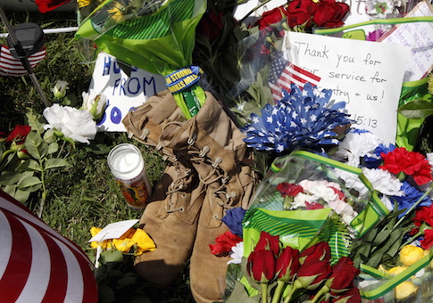 Items left at a memorial at the Armed Forces Career Center are seen in Chattanooga, Tennessee