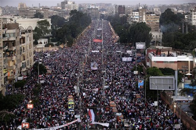 Egypt's ousted President Mohammed Morsi protest at the presidential palace in Cairo, Egypt, Friday, July 26, 2013 / AP